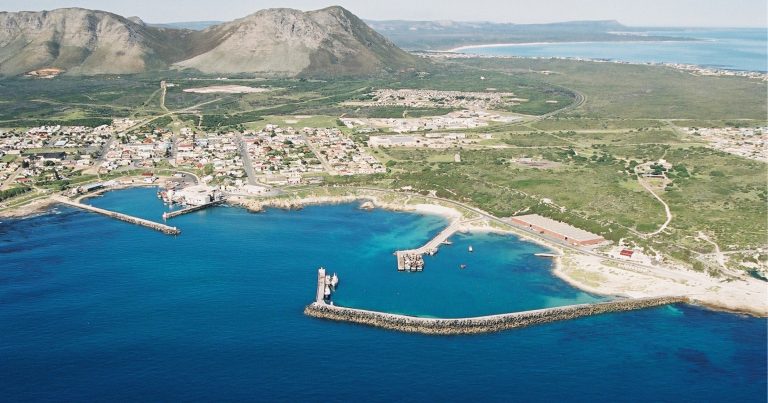 web-marine-dynamics-gansbaai-and-surrounds-gansbaai-harbour-and-mountain-drone-image-768×403